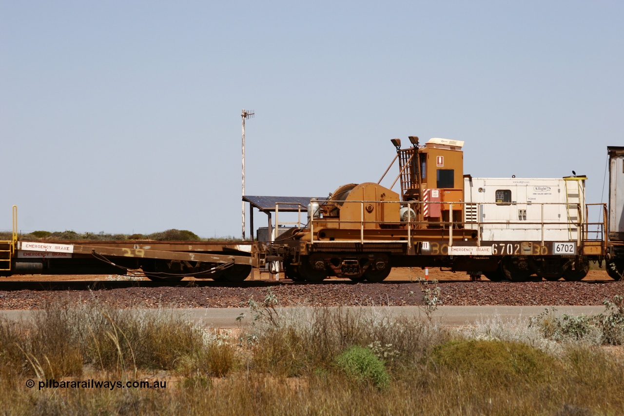 051001 5739
Boodarie, the Steel Train or rail recovery and transport train, flat waggon #30, 6702, heavily cut down and modified Magor USA ore waggon by Mt Newman Mining workshops, converted to a 50 tonne waggon and designated the winch waggon with generator set to power the winch and the crib car.
Keywords: Magor-USA;Mt-Newman-Mining-WS;BHP-rail-train;