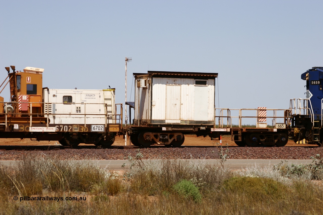 051001 5740
Boodarie, the Steel Train or rail recovery and transport train, cut down by Mt Newman Mining workshops, a Magor USA built former Oroville Dam 91 ton ore waggon 665, seen here being used as the crib waggon on the end of the steel train.
Keywords: Magor-USA;BHP-rail-train;