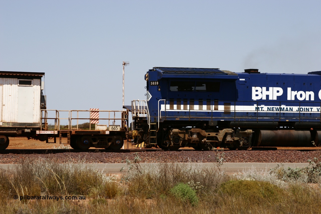 051001 5741
Boodarie, the Steel Train or rail recovery and transport train, cut down by Mt Newman Mining workshops, a Magor USA built former Oroville Dam 91 ton ore waggon 665, seen here being used as the crib waggon on the end of the steel train.
Keywords: Magor-USA;BHP-rail-train;