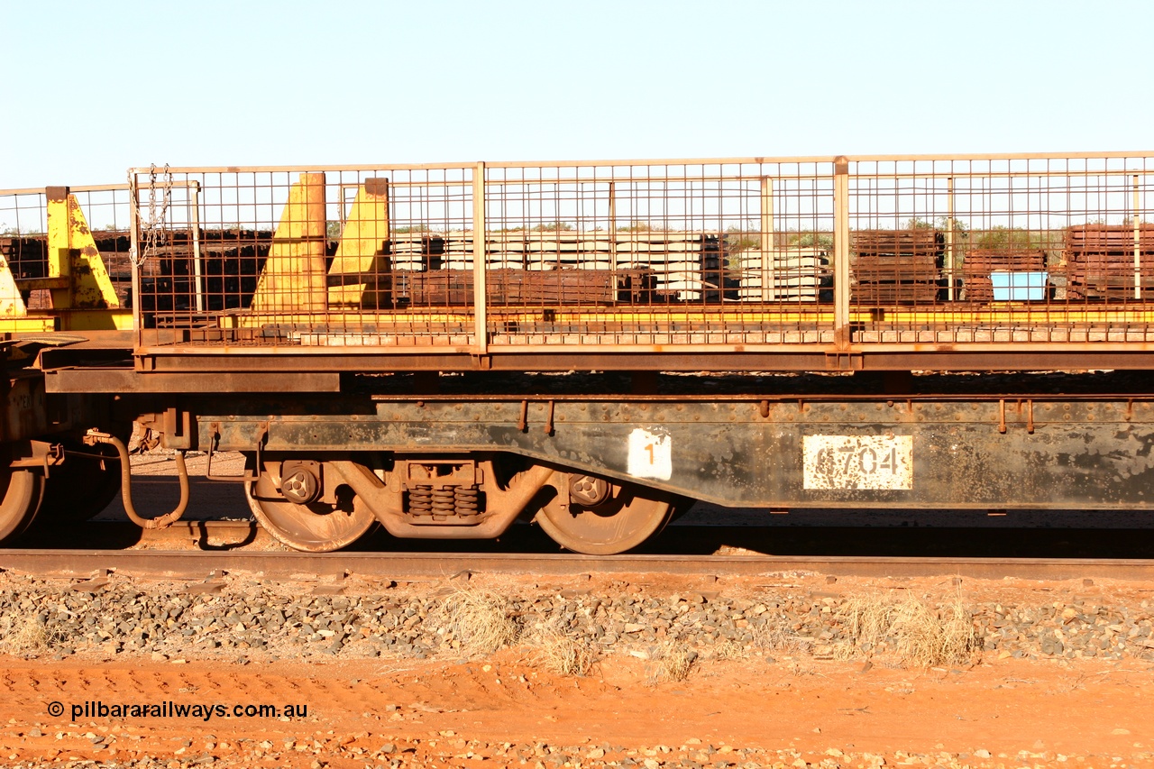 060429 3742
Flash Butt yard, Pony re-laying waggon 6704 flat waggon, unsure of history or who built it or where it came from, it looks to be heavy duty with riveted side frames and an odd handbrake arrangement.
Keywords: BHP-pony-waggon;