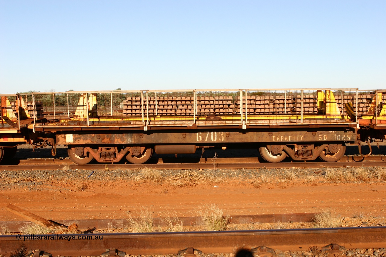 060429 3749
Flash Butt yard, Pony re-laying waggon 6703 is a heavily cut down and modified Magor USA ore waggon done by Mt Newman Mining workshops, converted to a 50 tonne flat waggon.
Keywords: BHP-pony-waggon;Magor-USA;Mt-Newman-Mining-WS;