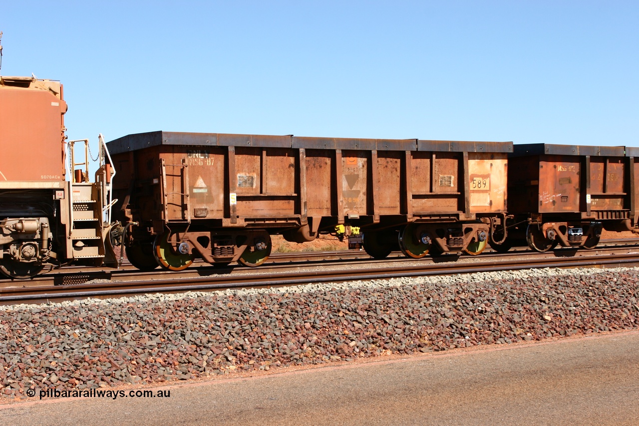 060710 6301
Boodarie Yard, modified original Magor USA built Oroville waggon 589, cut down and covered and in use as indexing waggons on the front of each rake for Finucane Island car dumpers, note the original ODCX marking visible.
Keywords: Magor-USA;Oroville;BHP-index-waggon;