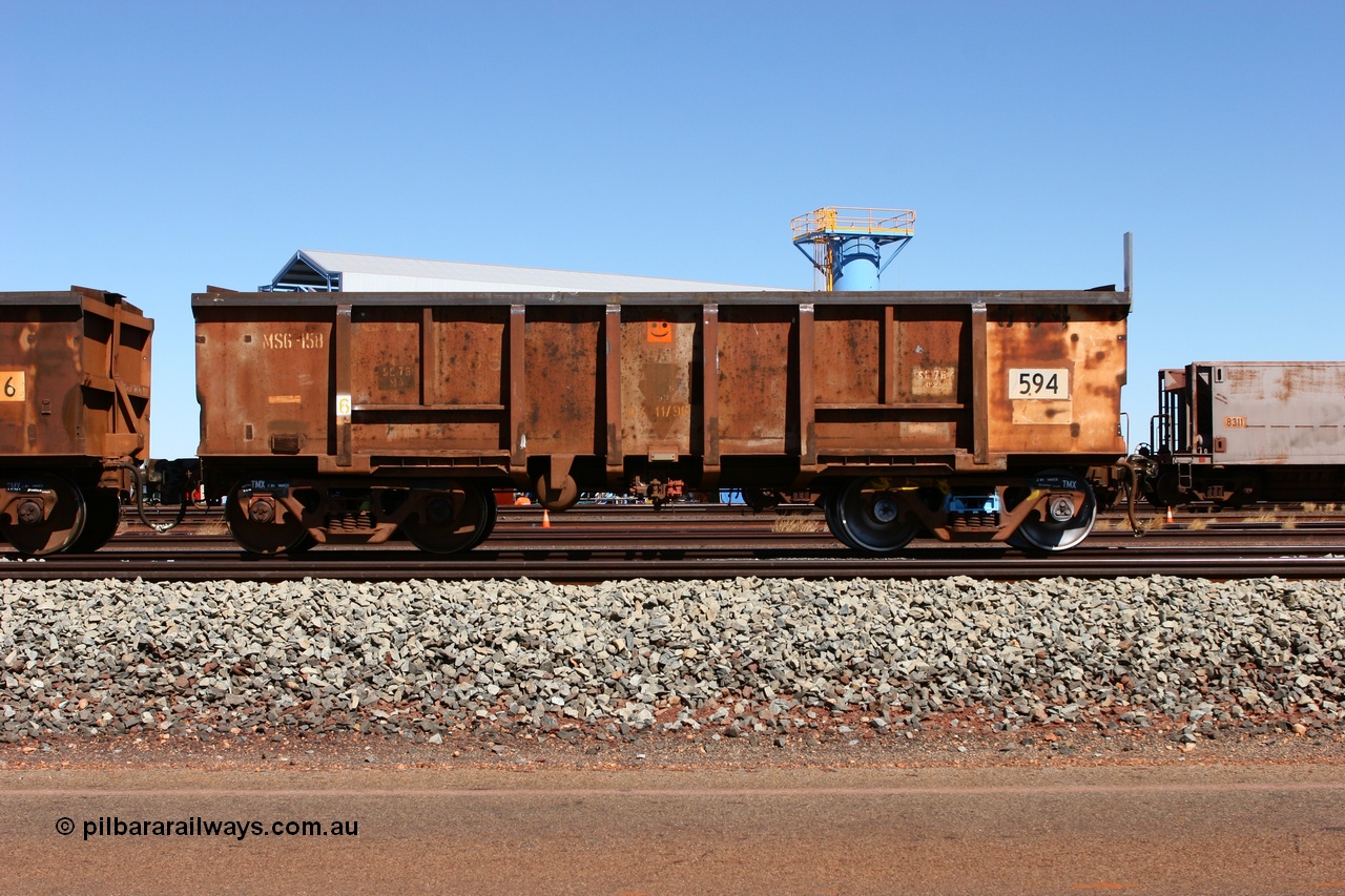 060713 6547
Boodarie Yard, modified original Magor USA built Oroville waggon 594, cut down and covered and in use as indexing waggons on the front of each rake for Finucane Island car dumpers, note the original ODCX marking visible.
Keywords: Magor-USA;Oroville;BHP-index-waggon;