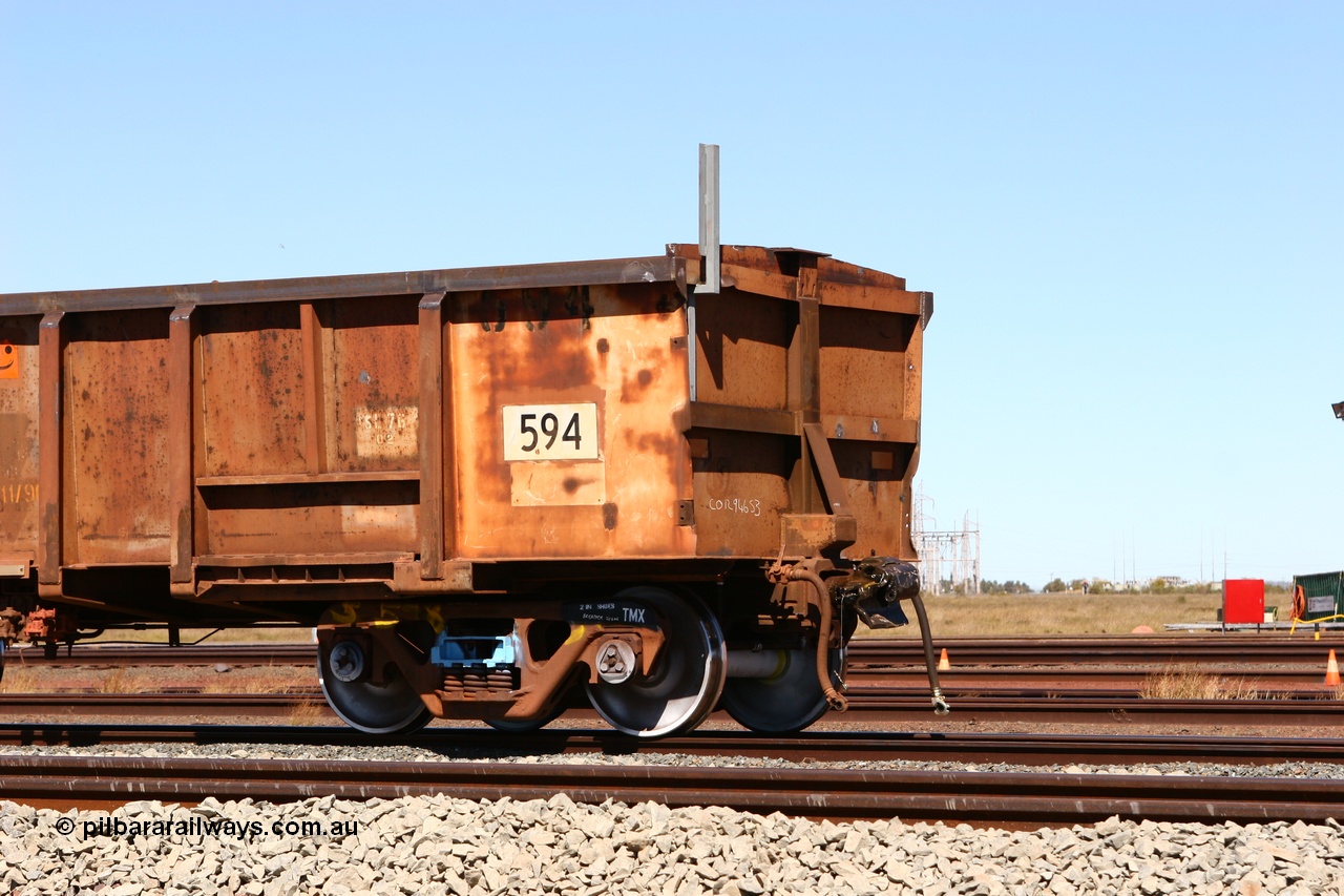 060713 6549
Boodarie Yard, modified original Magor USA built Oroville waggon 594, cut down and covered and in use as indexing waggons on the front of each rake for Finucane Island car dumpers, note the original ODCX marking visible.
Keywords: Magor-USA;Oroville;BHP-index-waggon;