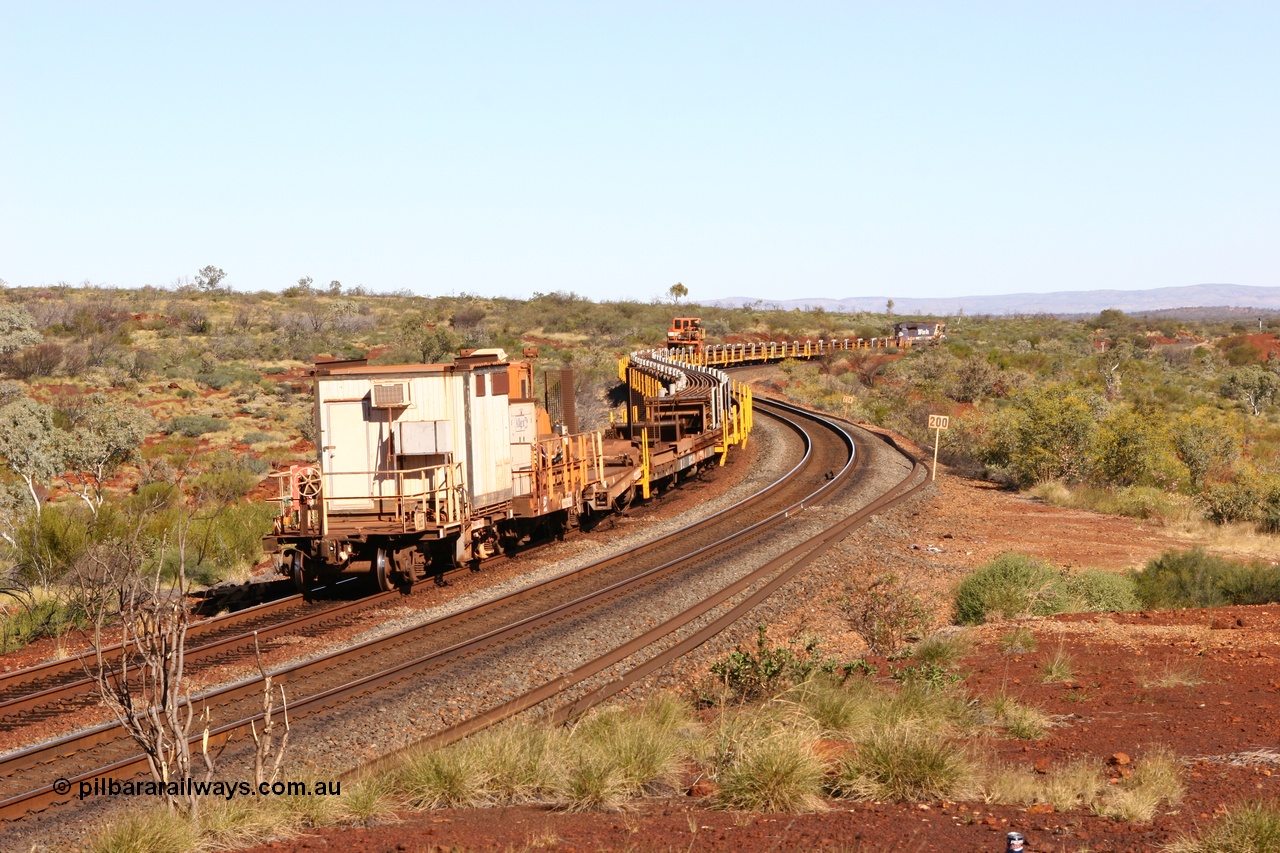 060714 6813
Hesta Siding, view from the rear of the rail recovery and transport train as it snakes around the curves. Crib waggon 665 a former Magor USA built ore waggon, heavily modified by Mt Newman Mining workshops and fitted with an ATCO donga.
Keywords: Mt-Newman-Mining-WS;Magor-USA;BHP-rail-train;