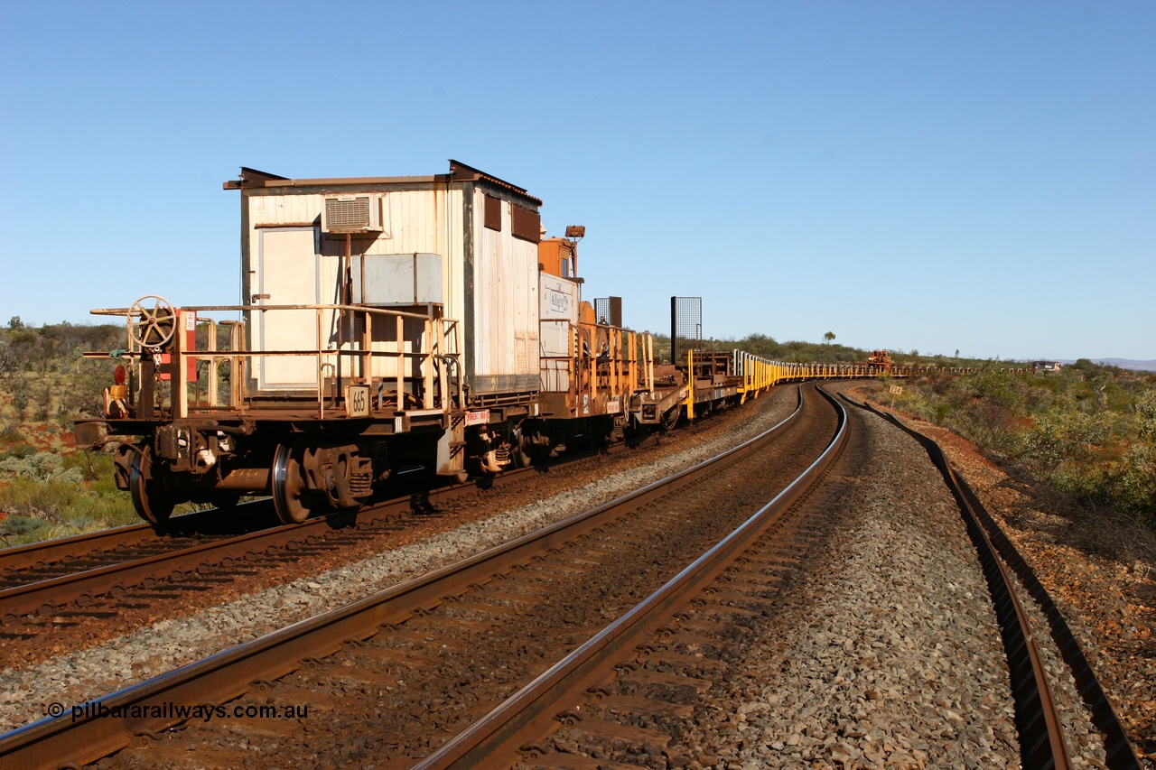 060714 6815
Hesta Siding, view from the rear of the rail recovery and transport train as it snakes around the curves. Crib waggon 665 a former Magor USA built ore waggon, heavily modified by Mt Newman Mining workshops and fitted with an ATCO donga.
Keywords: Mt-Newman-Mining-WS;Magor-USA;BHP-rail-train;