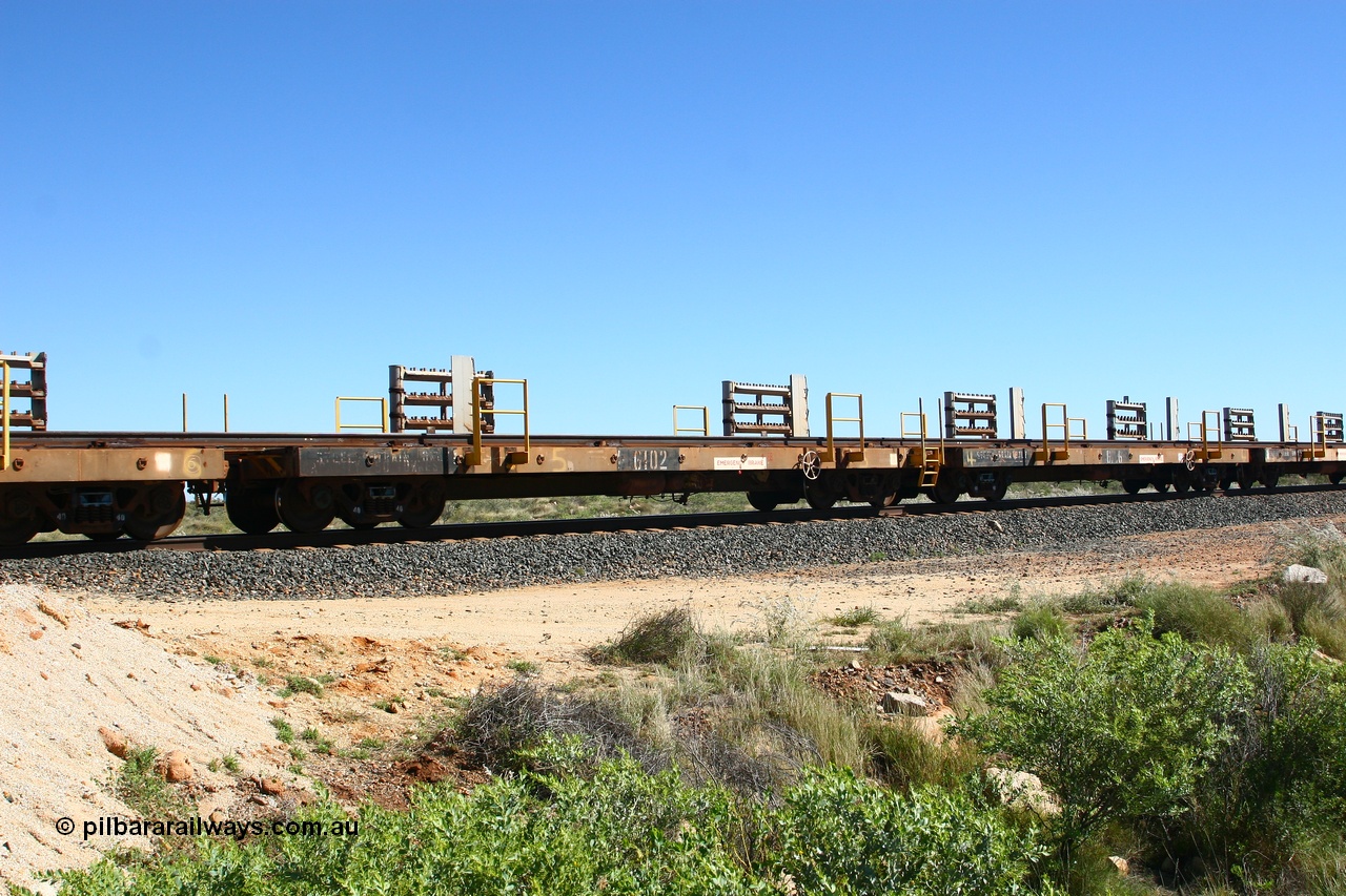 080621 2717
Tabba South, one of a batch of six flat waggons converted by Mt Newman Mining workshops by cutting down a pair of ore waggons to make one flat waggon, 6102 in service with the rail recovery and transport train as waggon #5.
Keywords: Mt-Newman-Mining-WS;Magor-USA;BHP-rail-train;