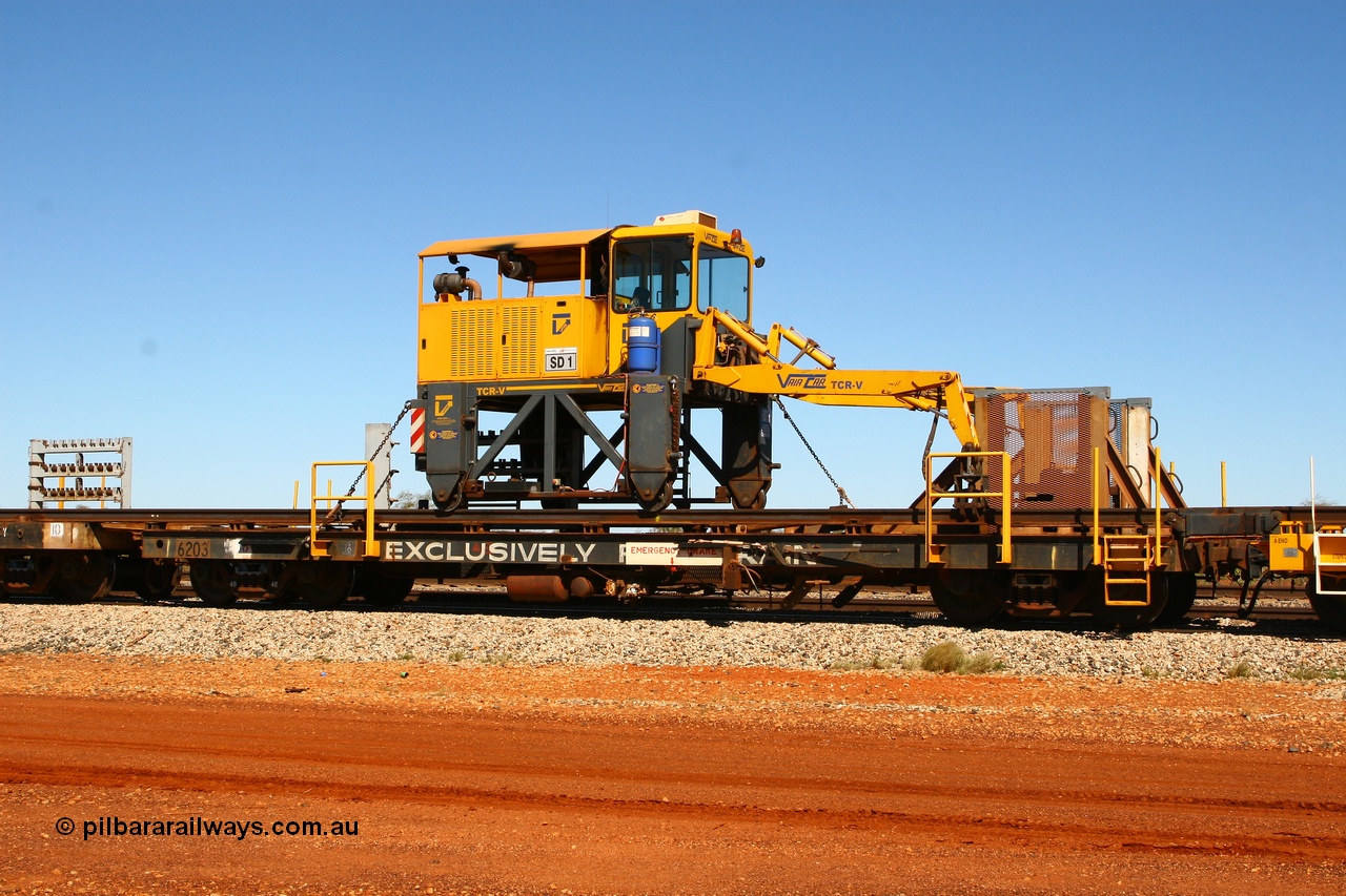 080621 2728
Gillman Siding, rail recovery and transport train flat waggon #1, rear lead off waggon 6203, built by Comeng WA in January 1977. The straddle crane is a newish unit built by Vaia Car model no. TCR-V and the four wheels are chain driven, replacing the original Gemco hydraulic unit.
Keywords: Comeng-WA;BHP-rail-train;