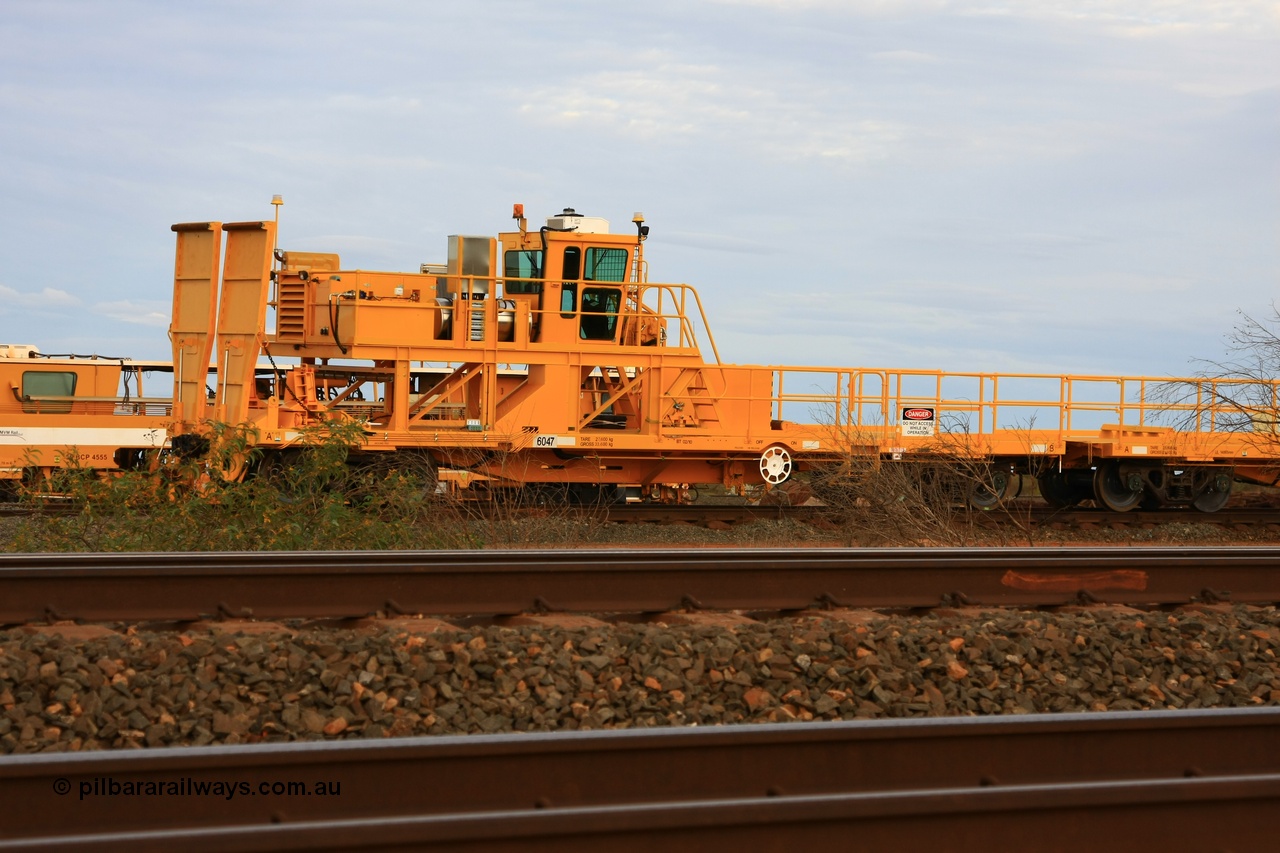 100717 0688
Flash Butt yard, new rail winch waggon 6047 obstructed by scrub, view from A end showing rail ramps, built by Gemco Rail in late 2009-10 with Barber bogies.
Keywords: Gemco-Rail-WA;BHP-rail-train;