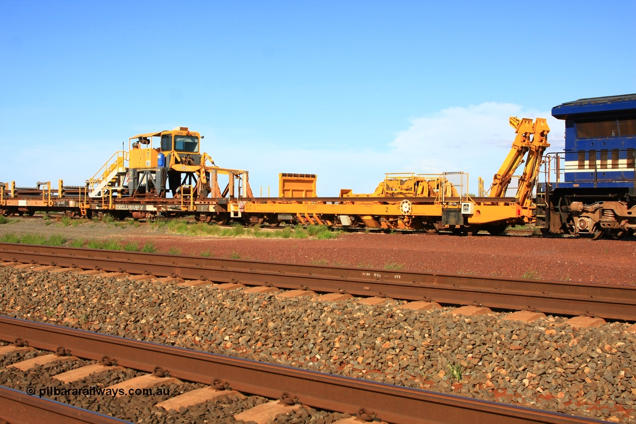 110208 9426
Flash Butt yard, new Lead-Off Lead-On waggon STTR class STTR 6214 on the end of the Steel Train or rail recovery and transport train, built by Gemco Rail WA, the chutes can be seen standing up with the squeeze rollers behind the mesh, with the new straddle crane sitting on flat waggon 6203 an original rear Lead-Off-On waggon.
Keywords: Gemco-Rail-WA;BHP-rail-train;STTR-type;STTR6214;