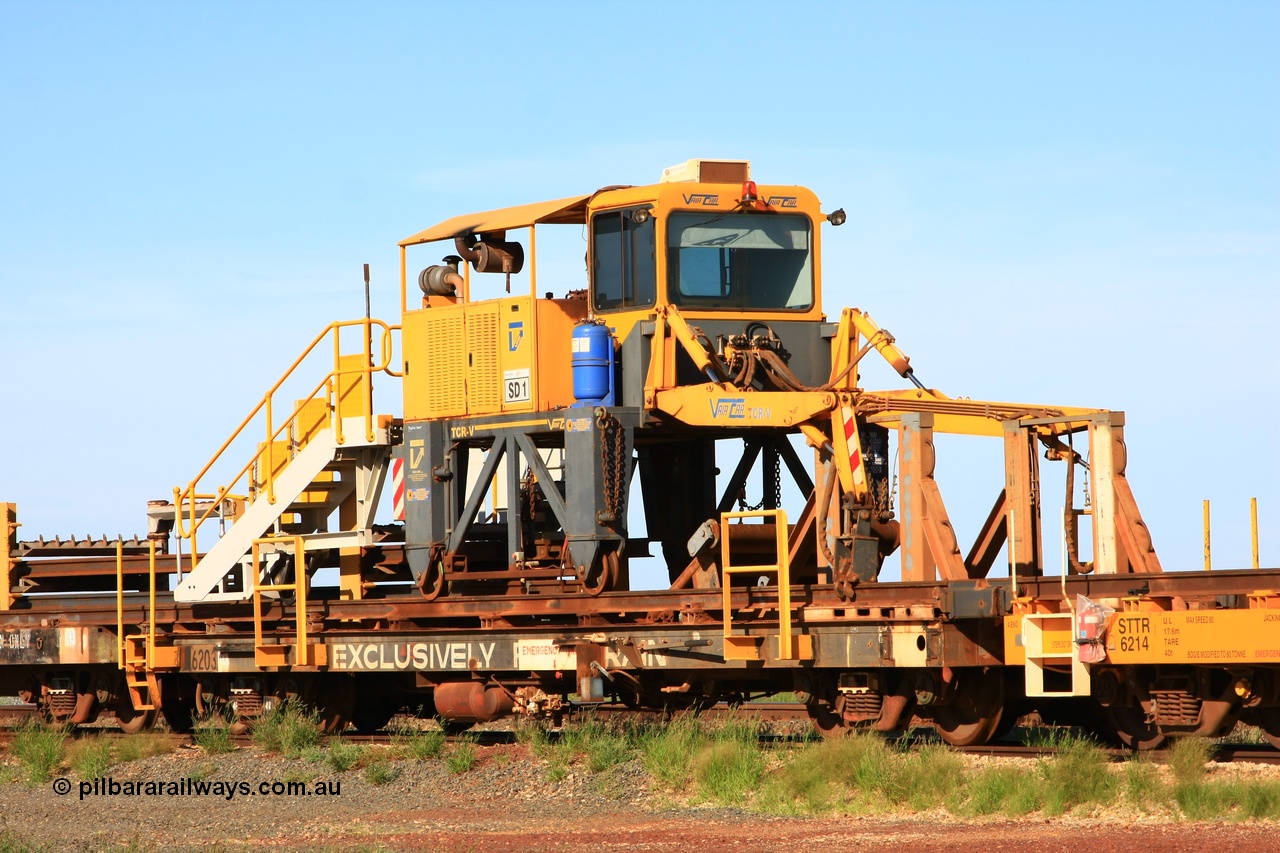 110208 9427
Flash Butt yard, rail recovery and transport train flat waggon rear lead off waggon 6203, built by Comeng WA in January 1977. The straddle crane is a newish unit built by Vaia Car model no. TCR-V and the four wheels are chain driven, replacing the original Gemco hydraulic unit.
Keywords: Comeng-WA;BHP-rail-train;