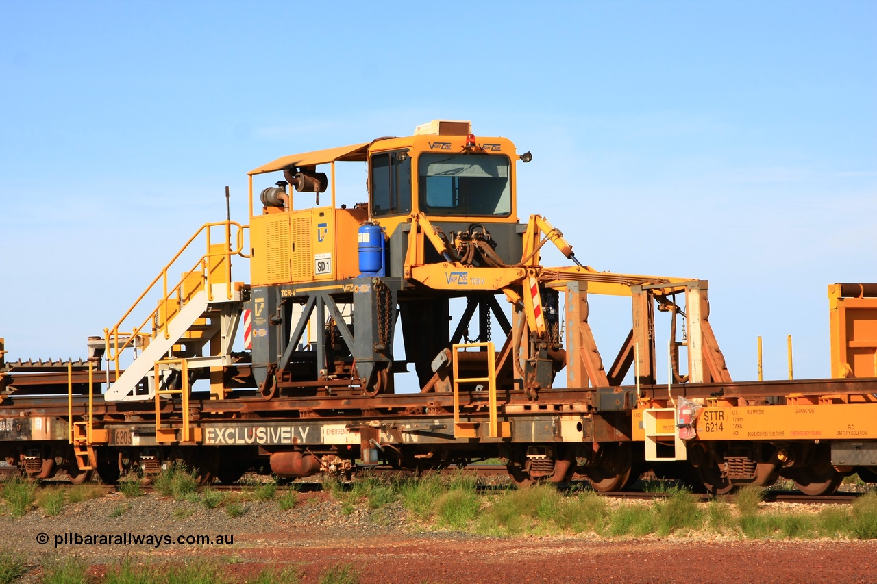 110208 9428
Flash Butt yard, rail recovery and transport train flat waggon rear lead off waggon 6203, built by Comeng WA in January 1977. The straddle crane is a newish unit built by Vaia Car model no. TCR-V and the four wheels are chain driven, replacing the original Gemco hydraulic unit.
Keywords: Comeng-WA;BHP-rail-train;