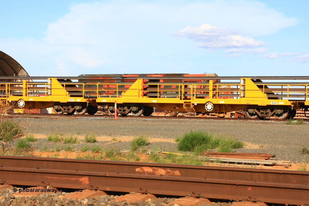 110208 9445
Flash Butt yard, new rail stock carrier waggon 6038 loaded with strings of rail, built by Gemco Rail in late 2009-10 with Barber bogies.
Keywords: BHP-rail-train;Gemco-Rail-WA;
