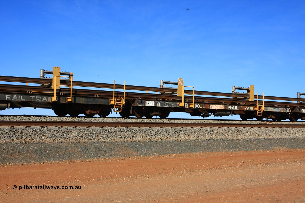 110619 1880
South of Mooka Siding, the Steel Train or rail recovery and transport train, flat waggon #10, 6204, a Comeng WA built flat waggon from January 1977 under order no. 07-M-282 RY.
Keywords: Comeng-WA;BHP-rail-train;