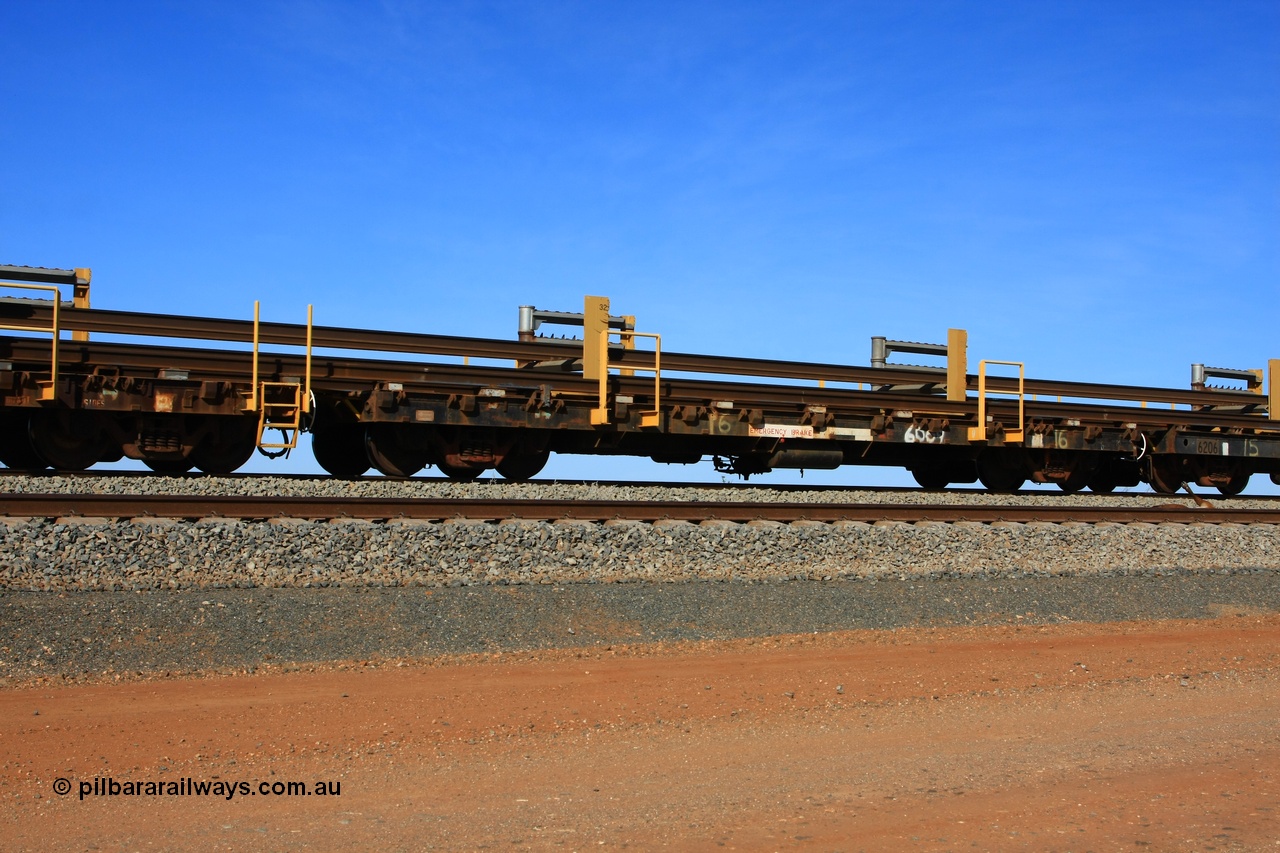 110619 1886
South of Mooka Siding, the Steel Train or rail recovery and transport train, flat waggon #16, 6009, a Scotts of Ipswich Qld built flat waggon from 1970.
Keywords: BHP-rail-train;Scotts-Qld;