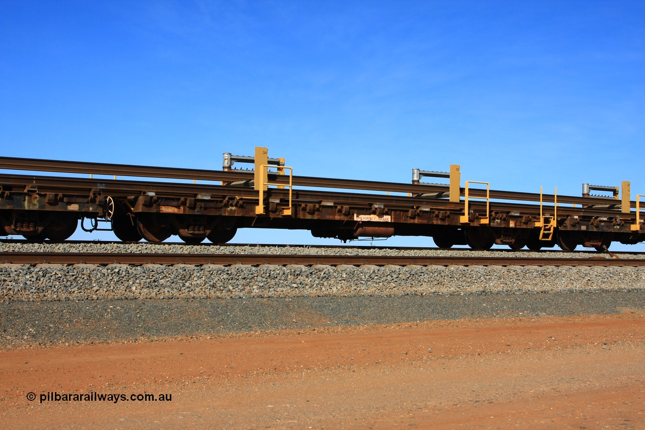 110619 1887
South of Mooka Siding, the Steel Train or rail recovery and transport train, flat waggon #17, 6016 with registered number 6506-016, a Comeng WA built flat waggon from 1971.
Keywords: Comeng-WA;BHP-rail-train;