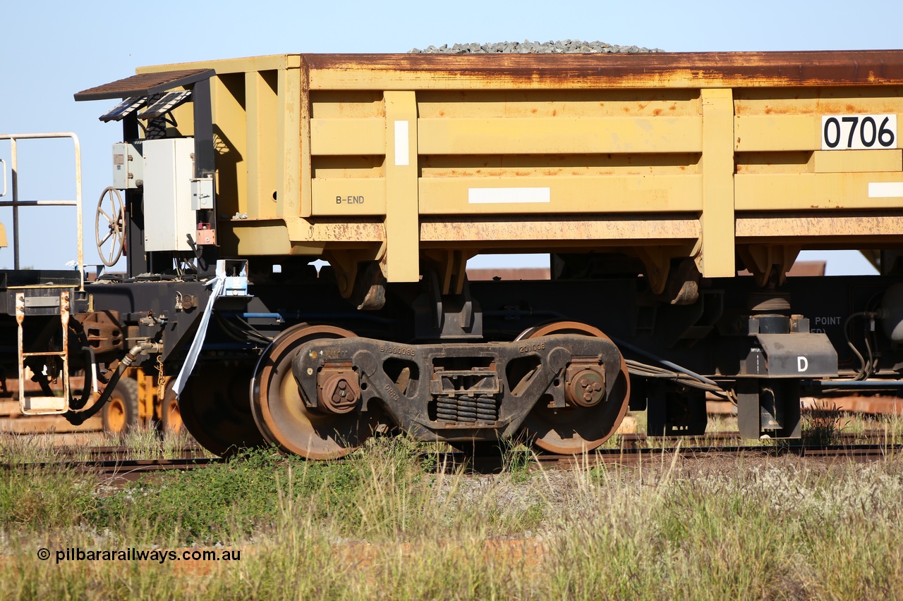 150619 9079
Flash Butt yard, CNR-QRRS of China built side dump waggons, built and delivered around 2011-12, waggon 0706 loaded with fines for sheeting, B end and bogie detail.
Keywords: CNR-QRRS-China;BHP-ballast-waggon;