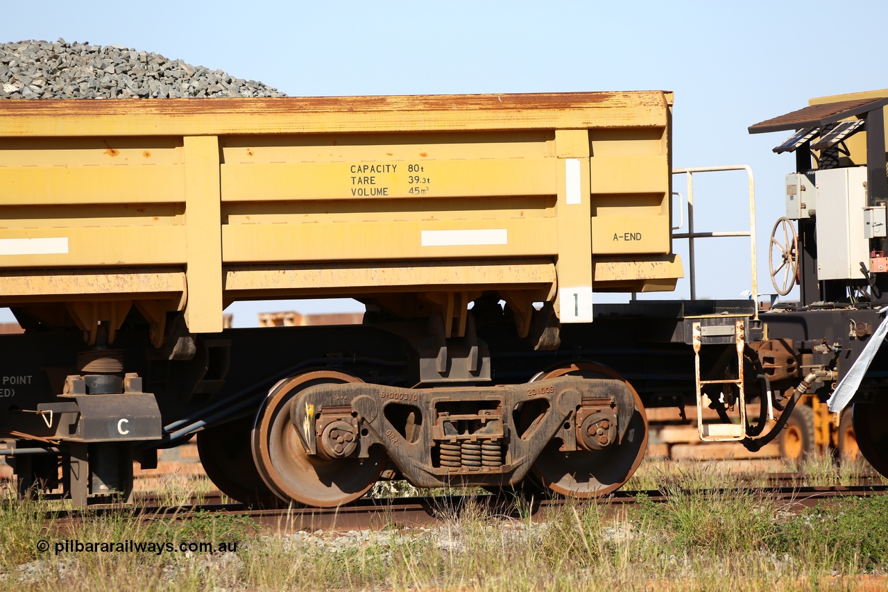 150619 9080
Flash Butt yard, CNR-QRRS of China built side dump waggons, built and delivered around 2011-12, waggon 0710 loaded with fines for sheeting, A end and bogie detail.
Keywords: CNR-QRRS-China;BHP-ballast-waggon;