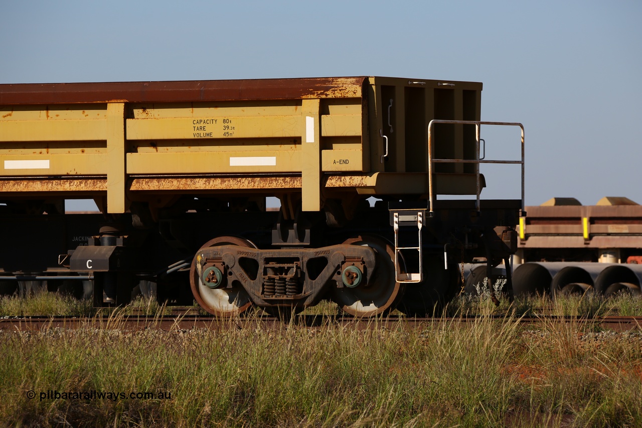 150619 9101
Flash Butt yard, CNR-QRRS of China built side dump waggons, built and delivered around 2011-12, waggon 0713 loaded with fines for sheeting, A end and bogie detail.
Keywords: CNR-QRRS-China;BHP-ballast-waggon;