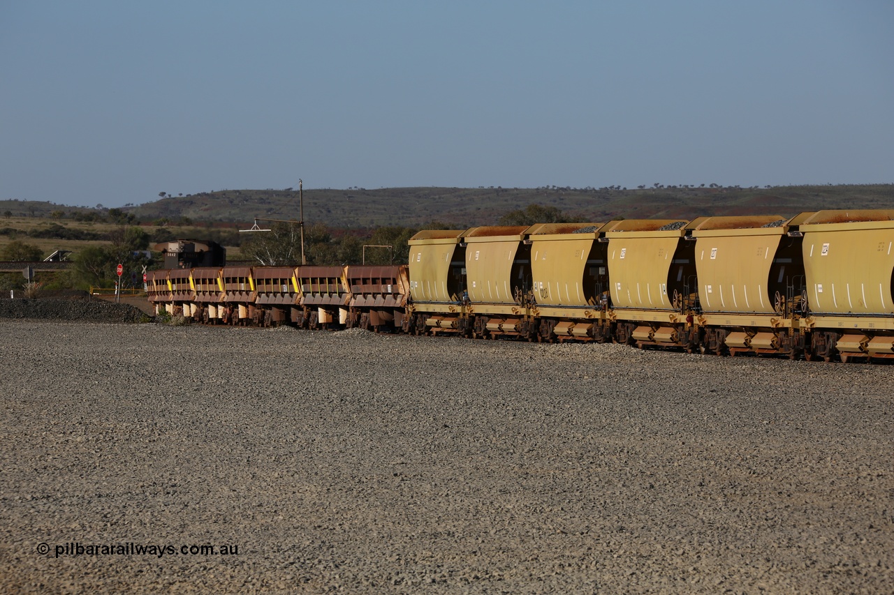 150620 9329
Quarry 8 ballast loading area, rake of CNR-QRRS of China built 99 tonne ballast waggons with the Difco USA built long and short side dump waggons with a Dash 8 loco on the rear.
Keywords: CNR-QRRS-China;BHP-ballast-waggon;Difco-Ohio-USA;