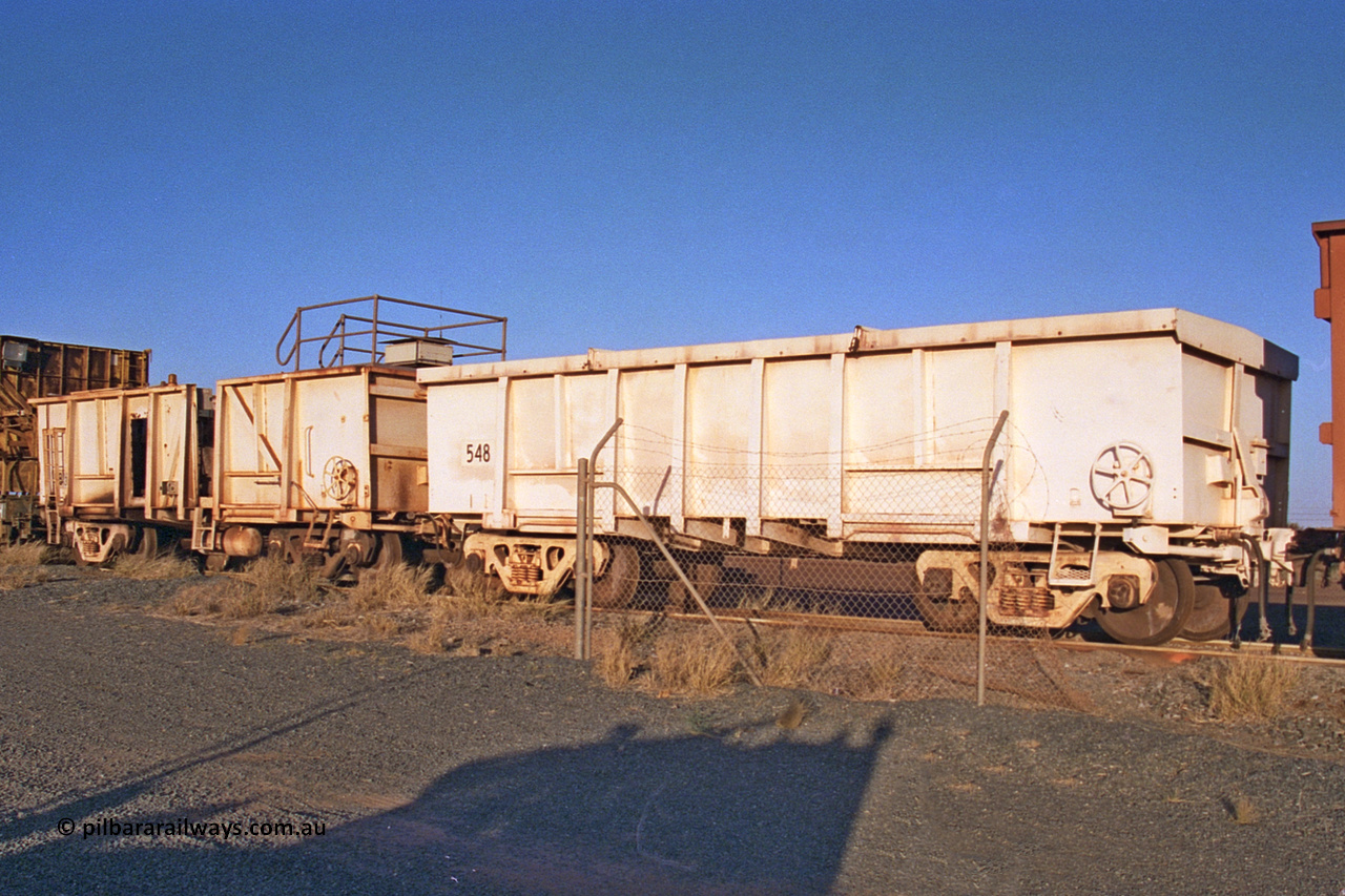 CC5 Mt Newman Mining Workshops 257-21
Flash Butt yard, compressor waggon set No. 5. Modified Magor USA built ore waggons 548 and 585 to form the compressor set. Was used during the unloading process, now seen here stored out of service.
Keywords: Magor-USA;BHP-compressor-set;