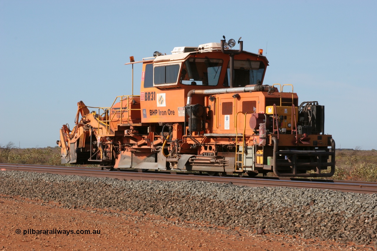 050411 0601
Goldsworthy Junction, BHP track machine ballast regulator BR 31 a Plasser Australia SSP 110SW model with serial 401 comes off the former Goldsworthy line with the Newman mainline in the foreground. 11th April 2005.
Keywords: BR31;Plasser-Australia;SSP-110SW;401;track-machine;