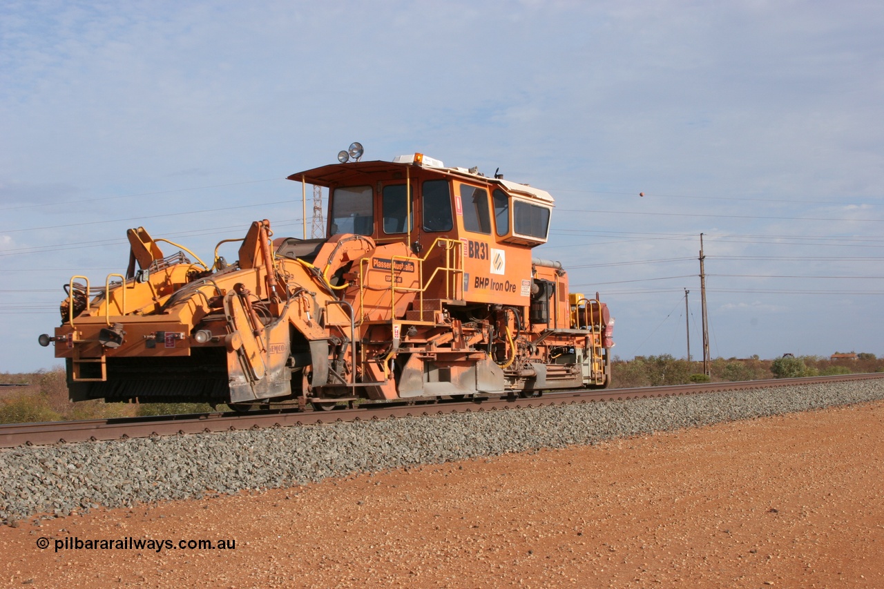 050411 0611
Goldsworthy Junction, BHP track machine ballast regulator BR 31 a Plasser Australia SSP 110SW model with serial 401 runs along the Newman mainline towards Bing Siding. 11th April 2005.
Keywords: BR31;Plasser-Australia;SSP-110SW;401;track-machine;