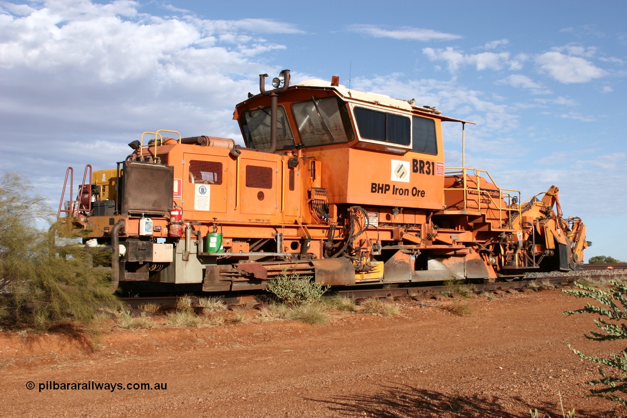 050421 1142
Gillam Siding backtrack, BHP's ballast regulator BR 31 a Plasser Australia SSP 110SW model serial 401, 94.9 km marking on the rail. 21st April 2005.
Keywords: BR31;Plasser-Australia;SSP-110SW;401;track-machine;