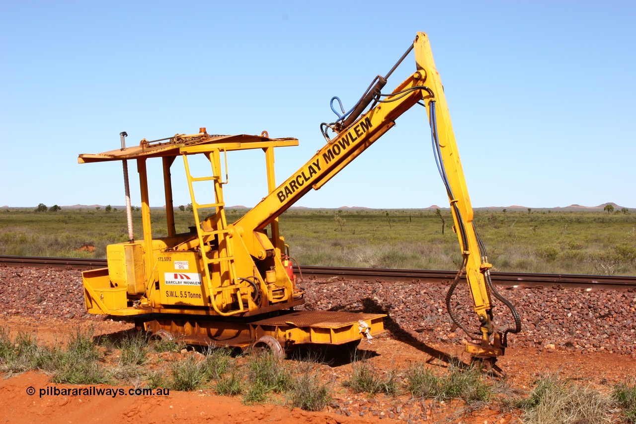 050625 3812
Node 2 at the 38 km on the GML or former Goldsworthy mainline, a Barclay Mowlem track machine sleeper crane off clear of the running lines. 25th June 2005.
Keywords: track-machine;