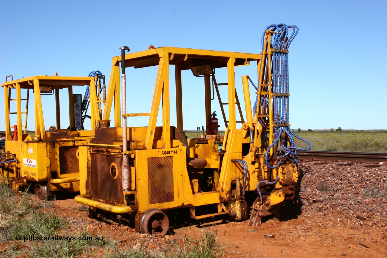 050625 3815
Node 2 at the 38 km on the GML or former Goldsworthy mainline, two Barclay Mowlem sleeper inserter track machines off clear of the running lines. 25th June 2005.
Keywords: track-machine;