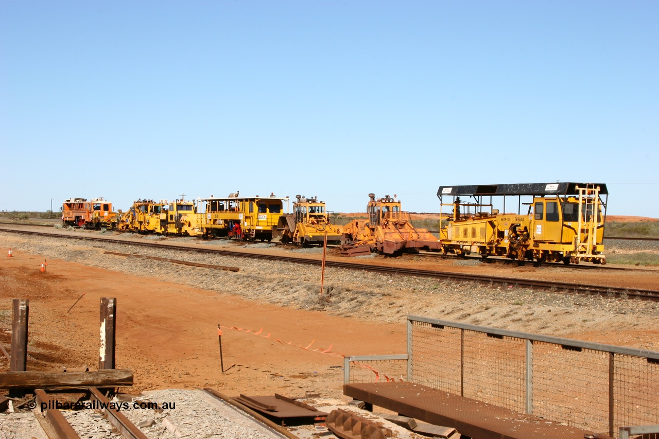 050801 4773
In the Flash Butt yard a line up of Barclay Mowlem track machines from the closest to the camera, tamper, regulator, regulator, tamper, clip installer, tamper then BHP's mainline tamper. 1st August 2005.
Keywords: track-machine;