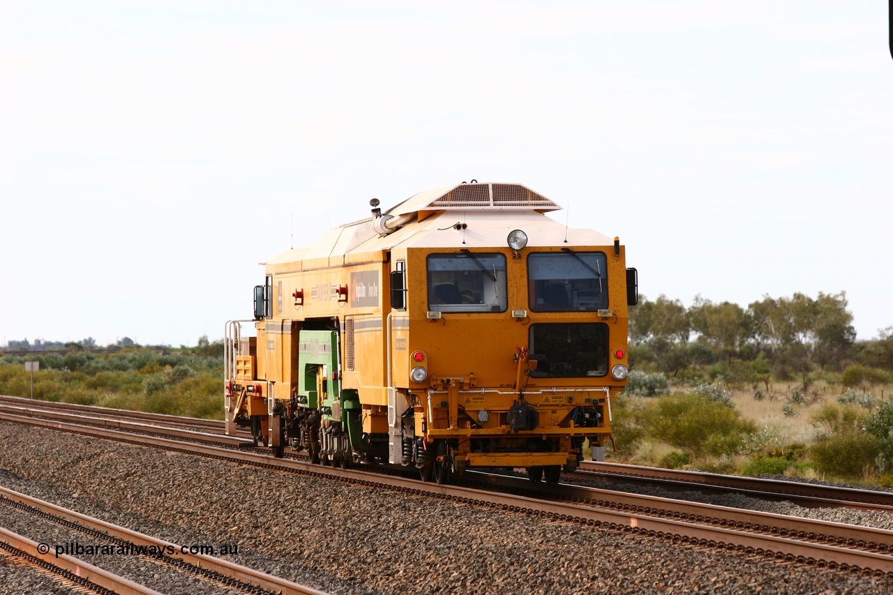 060326 3214
Bing Siding, BHP track machine Tamper 3 a Plasser Australia unit model 09-3X serial M480 runs towards Nelson Point on the mainline with the new western mainline in the foreground and Bing passing track on the right. 26th March 2006.
Keywords: Tamper3;Plasser-Australia;09-3X;M480;track-machine;