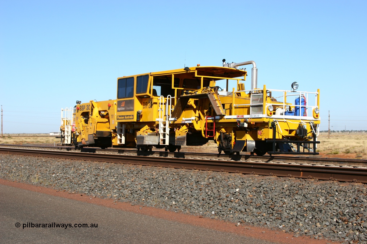 060710 6232
At the Broome Rd grade crossing Port Hedland, track machine BR 33 a Plasser Australia ballast regulator model SSP 302 serial M486. 10th July 2006.
Keywords: BR33;Plasser-Australia;SSP-302;M486;track-machine;