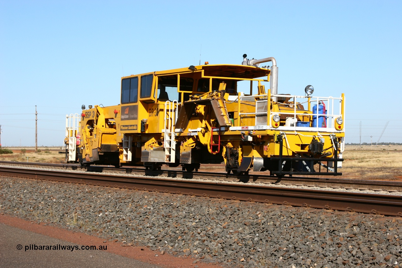 060710 6233
At the Broome Rd grade crossing Port Hedland, track machine BR 33 a Plasser Australia ballast regulator model SSP 302 serial M486. 10th July 2006.
Keywords: BR33;Plasser-Australia;SSP-302;M486;track-machine;