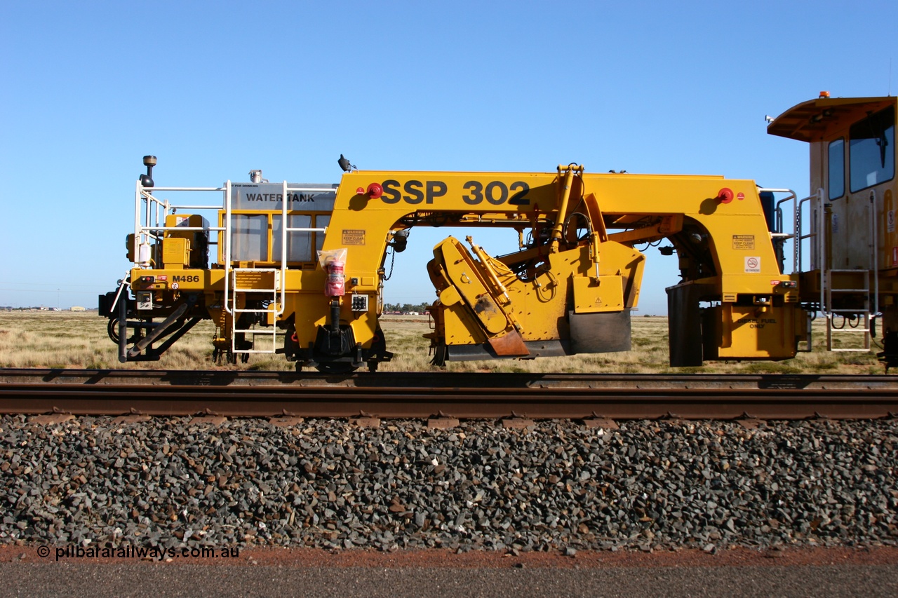 060710 6239
At the Broome Rd grade crossing Port Hedland, track machine BR 33 a Plasser Australia ballast regulator model SSP 302 serial M486. 10th July 2006.
Keywords: BR33;Plasser-Australia;SSP-302;M486;track-machine;