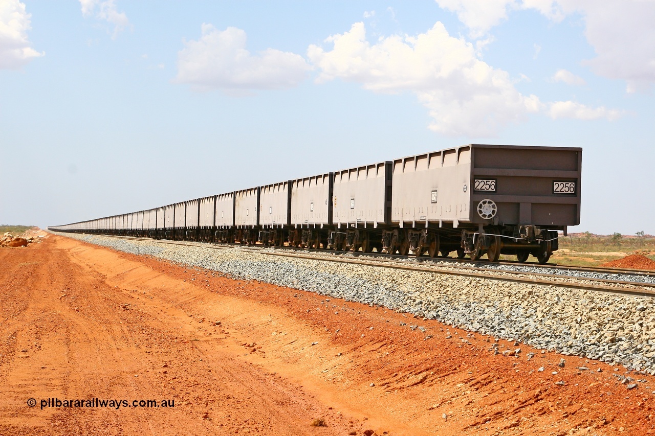 080124 1621
Chapman Siding, view looking north of a rake of new CSR Zhuzhou Rolling Stock Works China built waggons stabled in the passing track to free up yard room. 24th January 2008.
Keywords: FMG-ore-waggon;