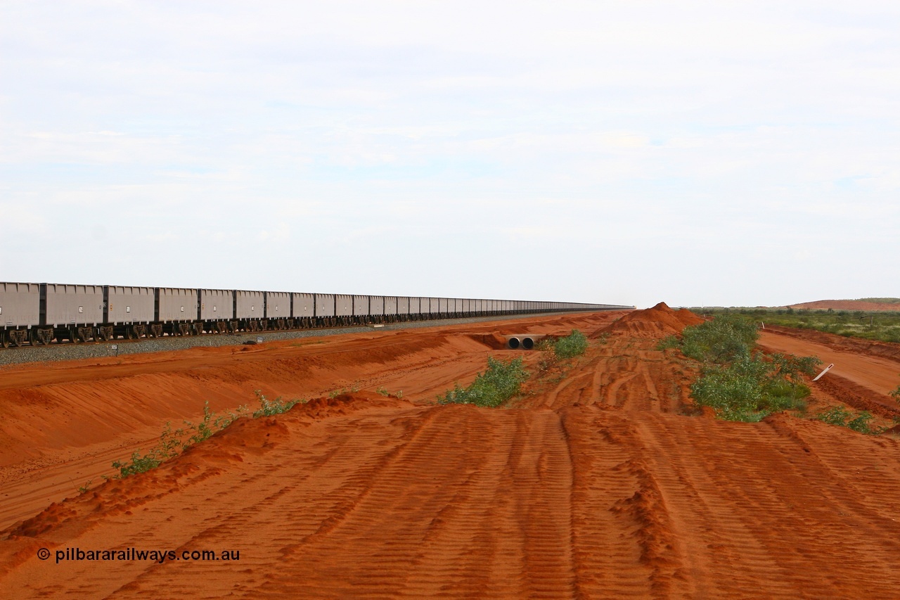 080304 2192
Thomas Yard, looking south, long rake of waggons being run up and down the mainline to keep the wheels turning. 4th March 2008.
Keywords: FMG-ore-waggon;
