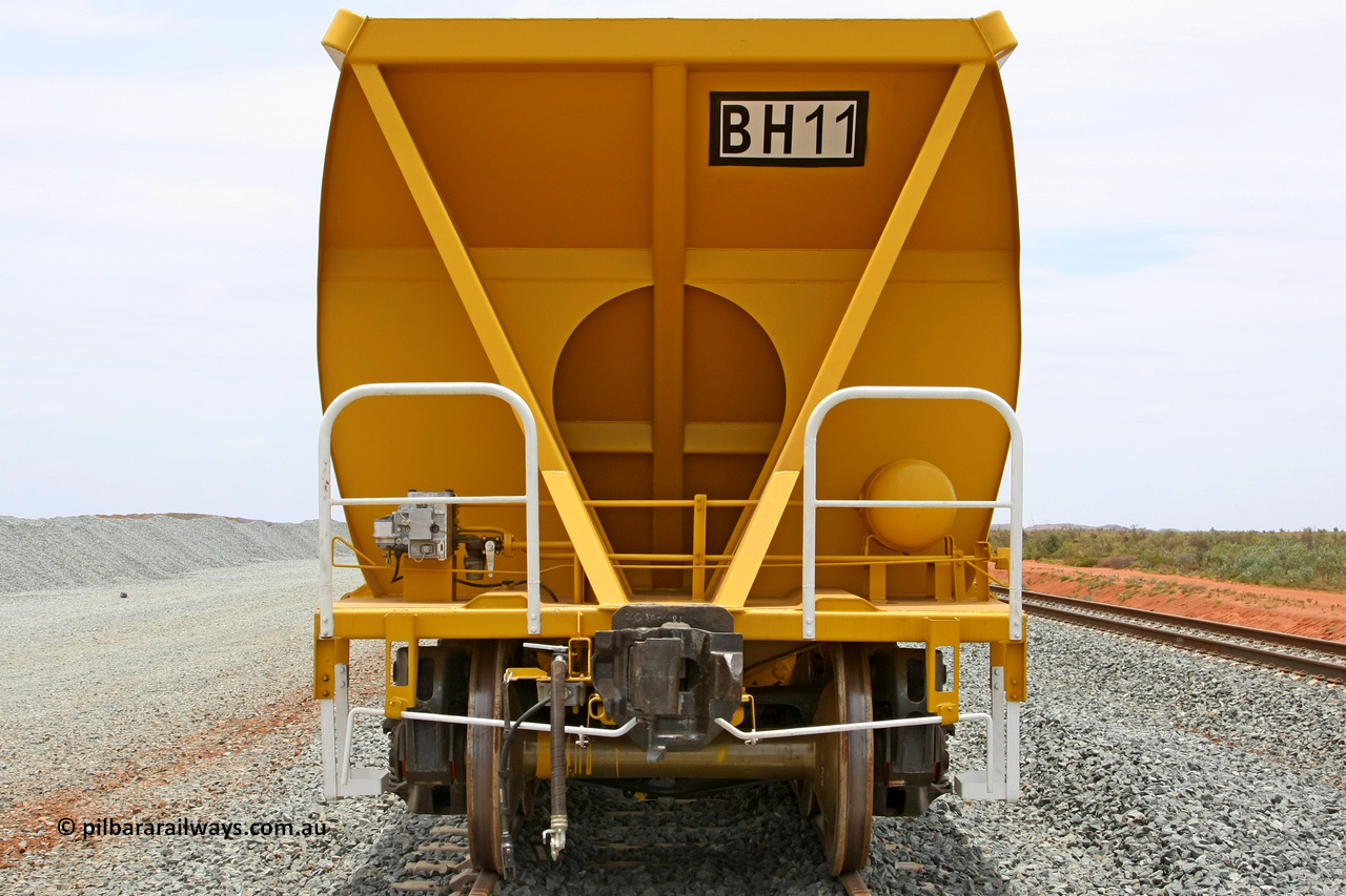 081225 0566
Barker Siding, one of FMG's thirty five ballast waggons, BH 11, non-handbrake end view, 100 tonne capacity, built in China by CSR at the Yangtze Rolling Stock Company in 2008. December 25, 2008.
Keywords: BH11;CSR-Yangtze-Rolling-Stock-Co-China;FMG-ballast-waggon;