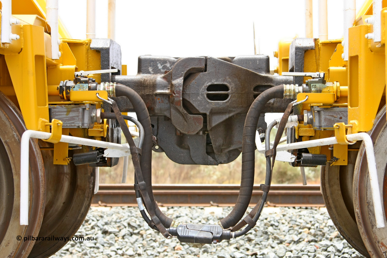 081225 0573
Barker Siding, view of two of FMG's ballast waggons F type couplings, electric and air connections. 100 tonne capacity, built in China by CSR at the Yangtze Rolling Stock Company in 2008. December 25, 2008.
Keywords: CSR-Yangtze-Rolling-Stock-Co-China;FMG-ballast-waggon;