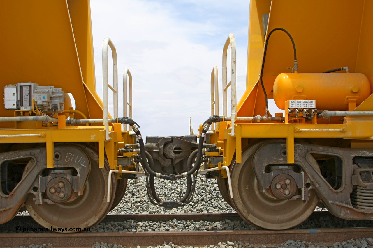 081225 0576
Barker Siding, view of two of FMG's ballast waggons F type couplings, electric and air connections with the separate air connection for unloading installed. 100 tonne capacity, built in China by CSR at the Yangtze Rolling Stock Company in 2008. December 25, 2008.
Keywords: CSR-Yangtze-Rolling-Stock-Co-China;FMG-ballast-waggon;