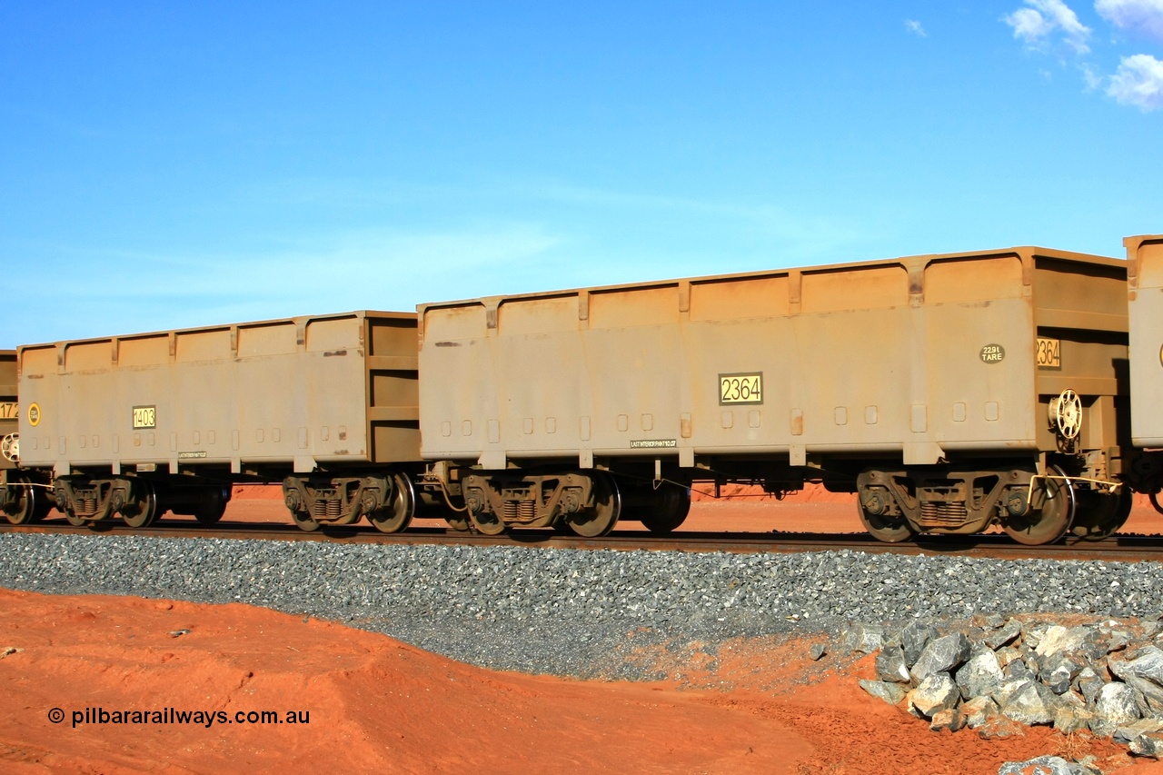 090121 1672
Boodarie, an FMG empty train departs the port with mismatched waggon pair slave 1403 22.6 tonnes tare and control 2364 22.9 tonne tare from the original CSR Zhuzhou Rolling Stock Works in China build from 2007.
Keywords: 1403-2364;CSR-Zhuzhou-Rolling-Stock-Works-China;FMG-ore-waggon