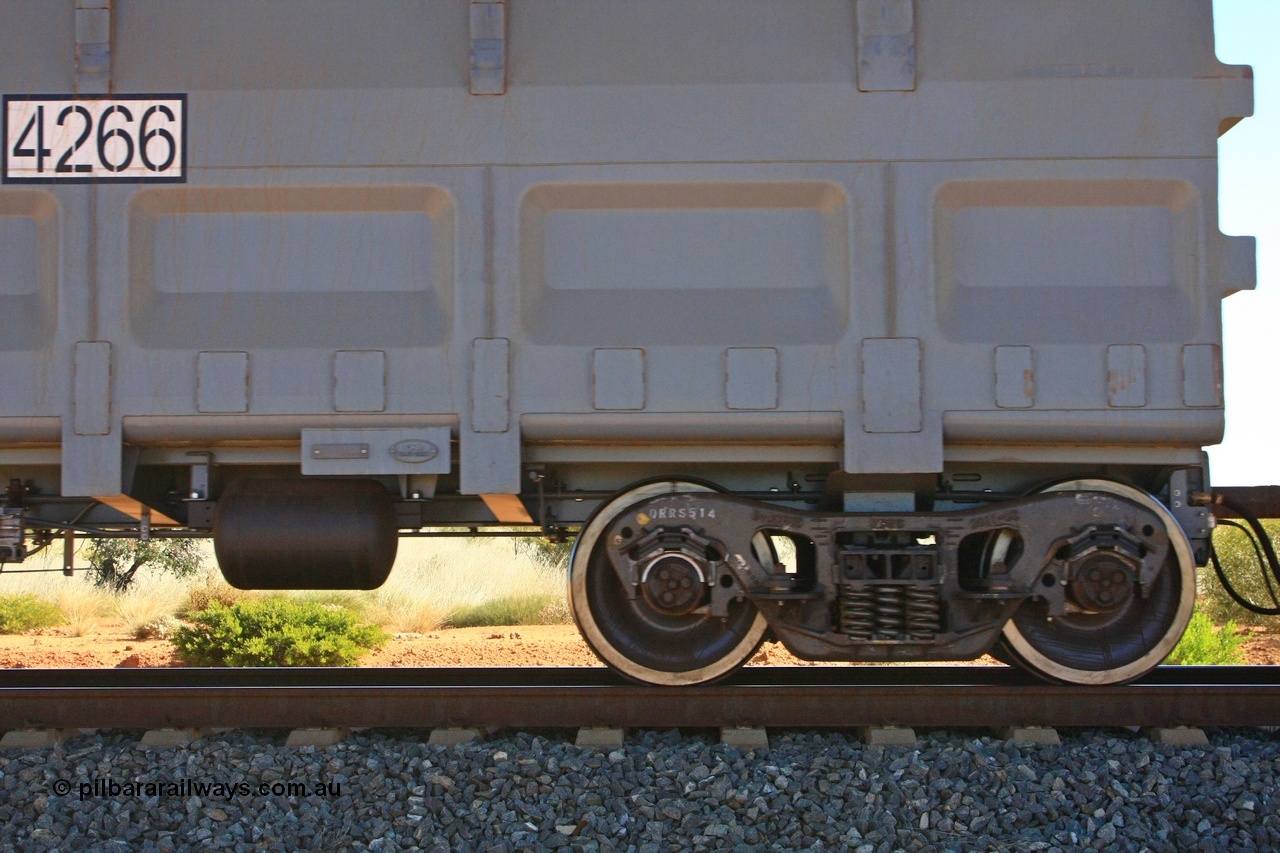 110620 2218
Forrest Siding near the 126 km, detail shot of empty FMG ore waggon 4266 showing the builders plate, RFID tag, number decal and bogie detail. CNR QRRS of China built waggon dating from 2011. 20th June 2011.
Keywords: 4266;CNR-QRRS-China;FMG-ore-waggon;