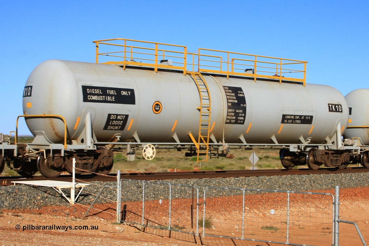 110620 2274
Chapman, FMG TK type fuel tank waggon TK 10 built by China Southern CSR at their Zhuzhou Rolling Stock Works plant in China in 2008 as part of an order for twelve tanks, is on the loaded fuel train to Cloud Break. 20th June 2011.
Keywords: TK10;TK-type;CSR-Zhuzhou-Rolling-Stock-Works-China;FMG-tank-waggon;