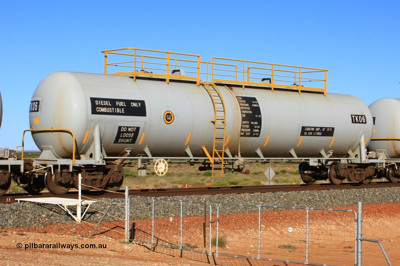 110620 2275
Chapman, FMG TK type fuel tank waggon TK 06 built by China Southern CSR at their Zhuzhou Rolling Stock Works plant in China in 2008 as part of an order for twelve tanks, is on the loaded fuel train to Cloud Break. 20th June 2011.
Keywords: TK06;TK-type;CSR-Zhuzhou-Rolling-Stock-Works-China;FMG-tank-waggon;