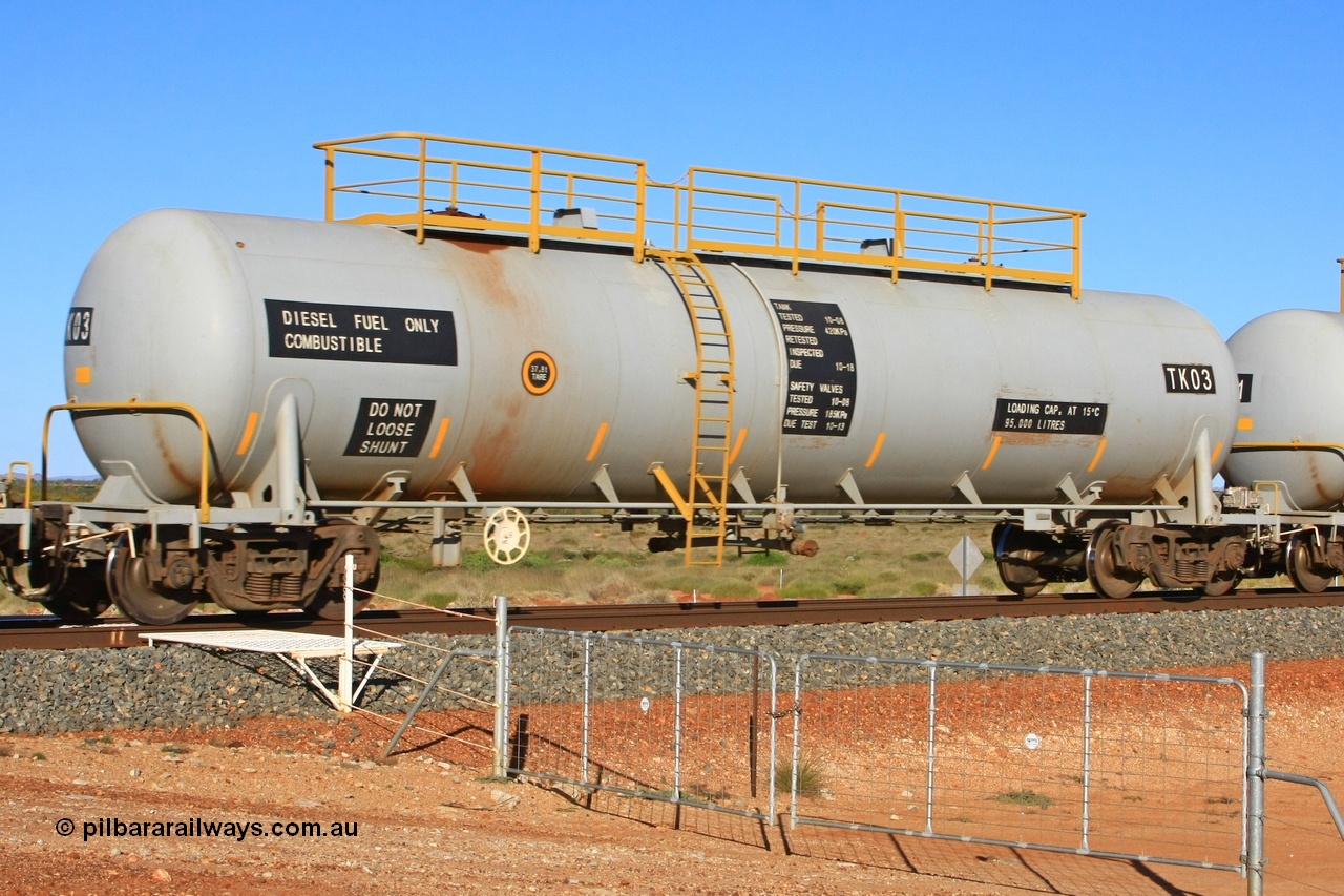 110620 2282
Chapman, FMG TK type fuel tank waggon TK 03 built by China Southern CSR at their Zhuzhou Rolling Stock Works plant in China in 2008 as part of an order for twelve tanks, is on the loaded fuel train to Cloud Break. 20th June 2011.
Keywords: TK03;TK-type;CSR-Zhuzhou-Rolling-Stock-Works-China;FMG-tank-waggon