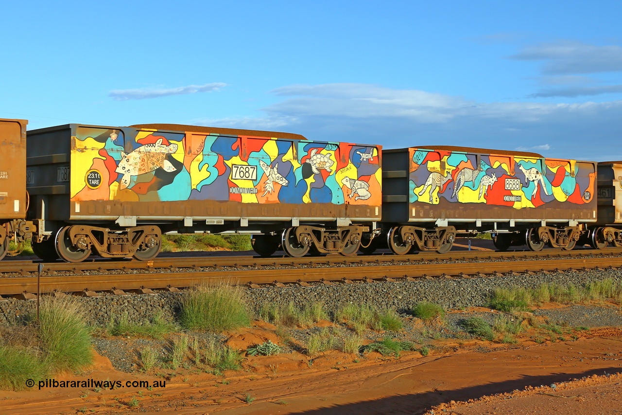 200412 6176
Boodarie, part of a loaded FMG train, painted ore waggon pair 7687 - 8688 built by CRRC Yangtze Rolling Stock Co. of China in 2018, it features mural painting by students of South Hedland High School and was painted in August 2018. April 12, 2020.
Keywords: 7687-8688;CRRC-Yangtze-China;FMG-ore-waggon