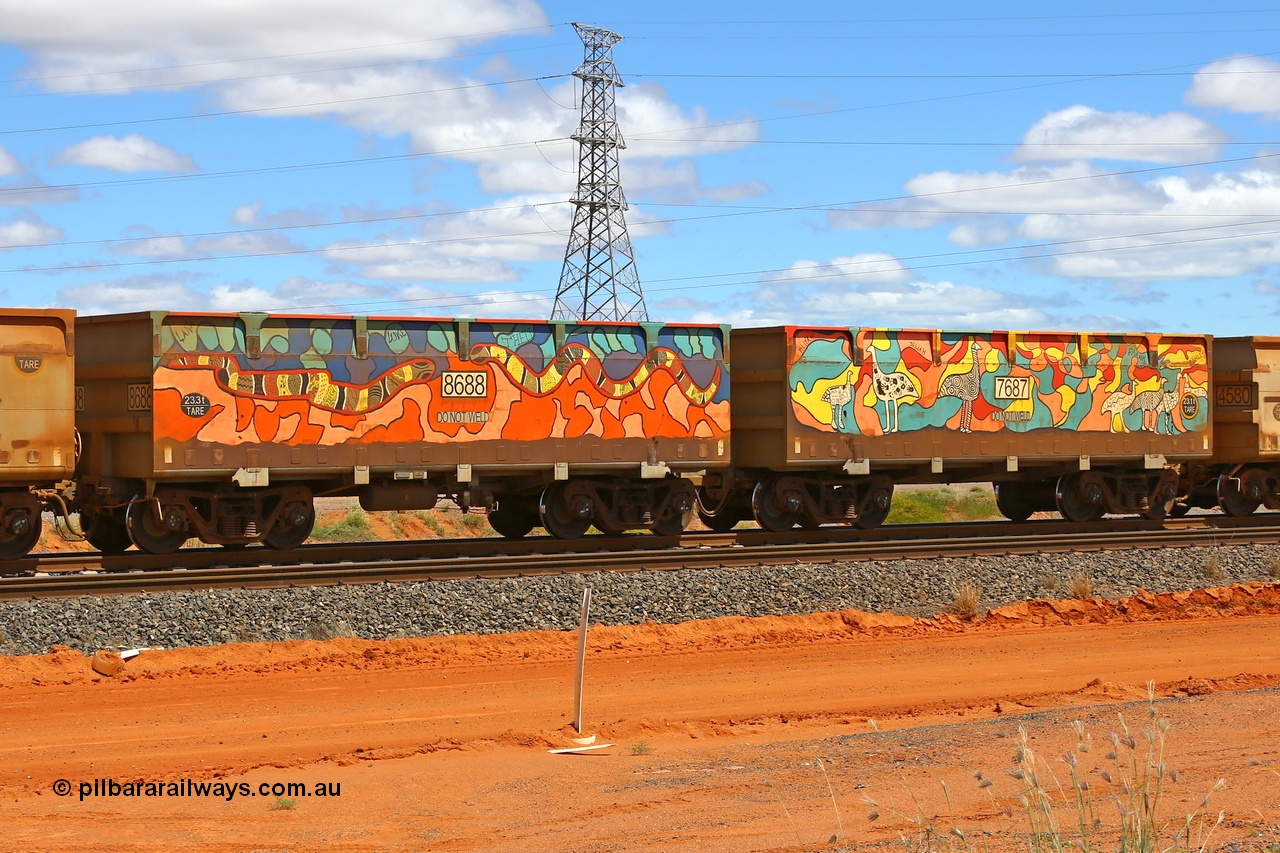 210321 9036
Boodarie, part of a loaded FMG train, painted ore waggon pair 7687 - 8688 built by CRRC Yangtze Rolling Stock Co. of China in 2018, it features mural painting by students of South Hedland High School and was painted in August 2018. March 21, 2021.
Keywords: 7687-8688;CRRC-Yangtze-China;FMG-ore-waggon