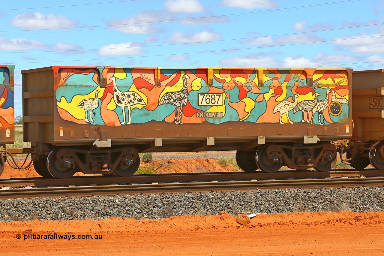 210321 9038
Boodarie, part of a loaded FMG train, painted ore waggon pair 7687 - 8688 built by CRRC Yangtze Rolling Stock Co. of China in 2018, 7687 waggon view, it features mural painting by students of South Hedland High School and was painted in August 2018. March 21, 2021.
Keywords: 7687-8688;CRRC-Yangtze-China;FMG-ore-waggon