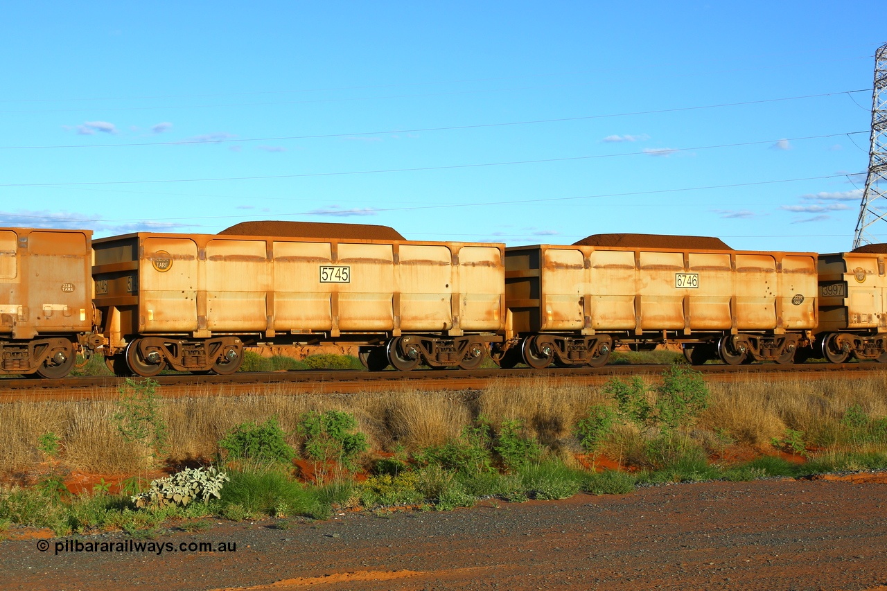 210321 9302
Boodarie on the 5 km curve loaded FMG ore waggon pair 5745 and 6746 were built by CSR Yangtze with a prototype pressed lower panels. This pair is the same as 3005 - 4006. 21st March 2021.
Keywords: CSR-Yangtze-Rolling-Stock-Co-China