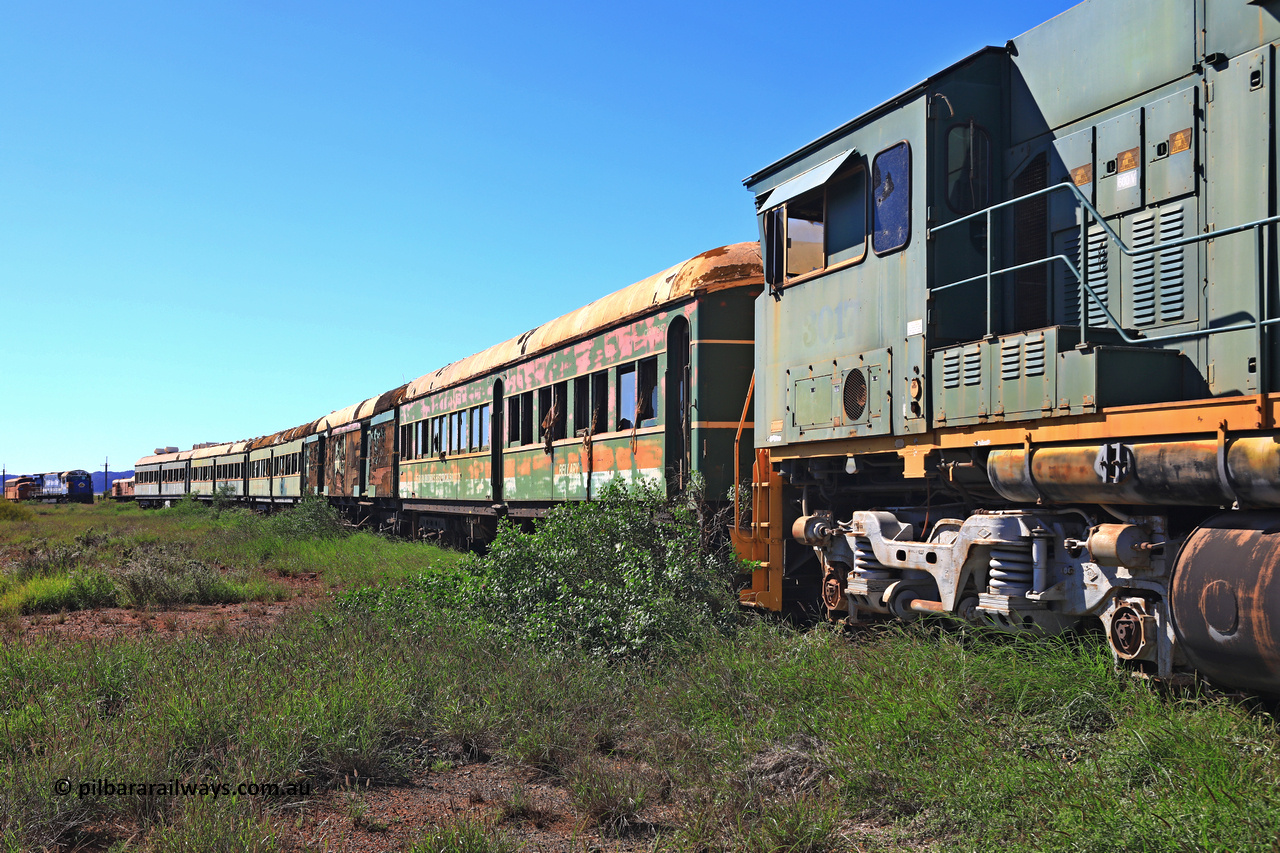 240701 2740
Pilbara Railways Historical Society, view along the passenger carriages behind rebuilt ALCo C636R locomotive 3017 with the first passenger carriage 'Bellary' was originally built by Clyde Engineering at Granville NSW in 1936 for the NSWGR as a second class railway carriage FS type FS 2143. In 1987 it was purchased by the Society and is named after a local river. The next carriage is van 'Portland' and originally an NSWGR MHO type guards van MHO 2321, then recoded to KB type mail van, then to KBY 2513 guards van. For a view 20 years ago, [url=https://pilbararailways.com.au/gallery/displayimage.php?pid=15299]click here[/url]. July 1, 2024.

